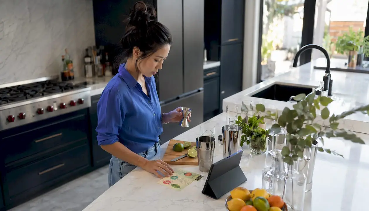 Woman participating in virtual cocktail class at home