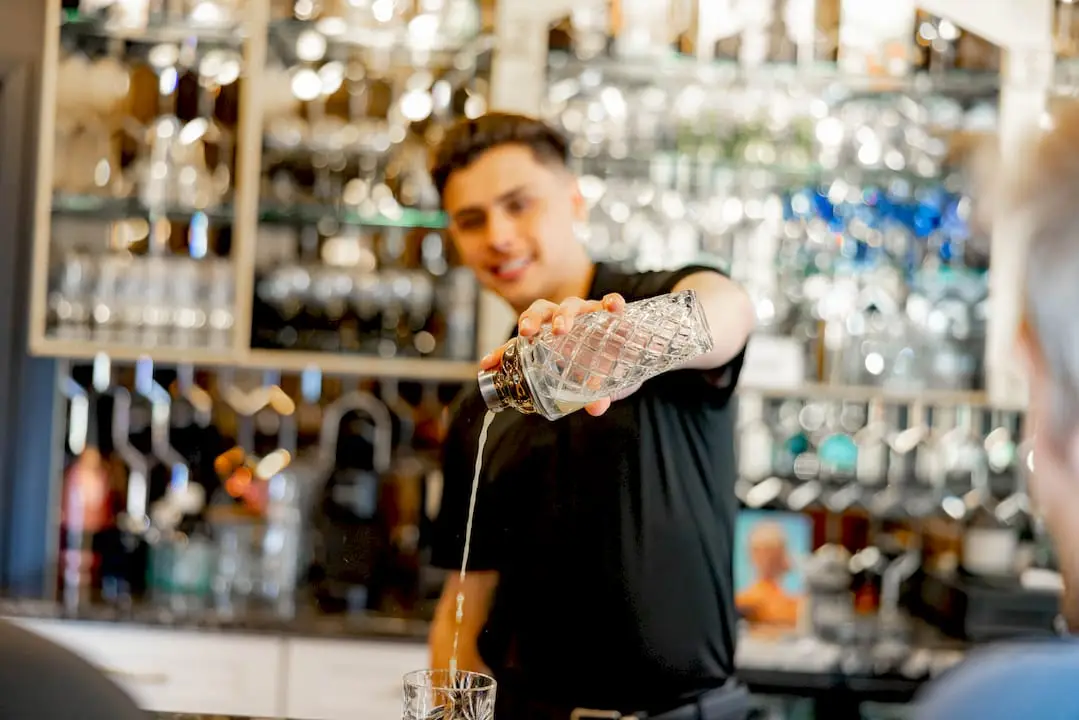 Couple planning wedding bar budget at home