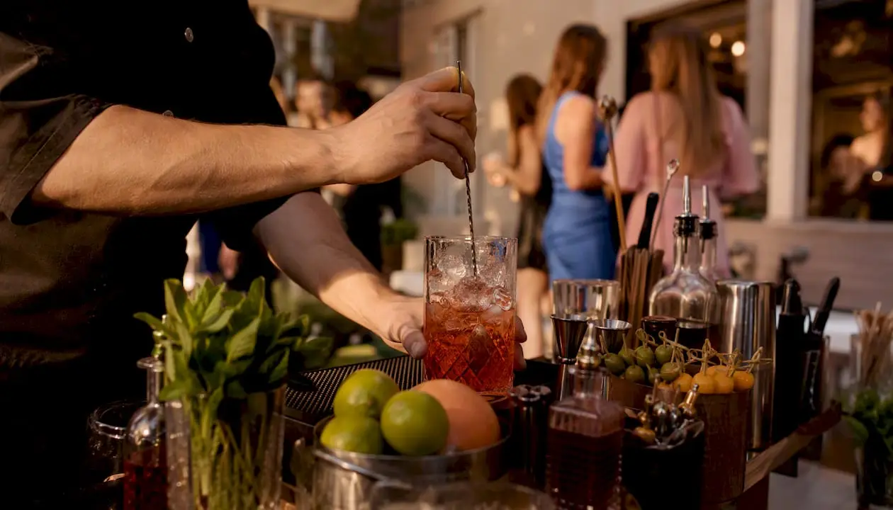 Bartender shaking cocktail at mobile bachelorette party