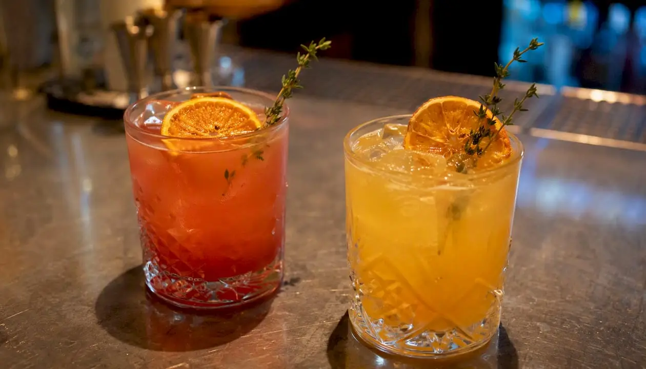 Signature cocktail and matching mocktail with garnishes