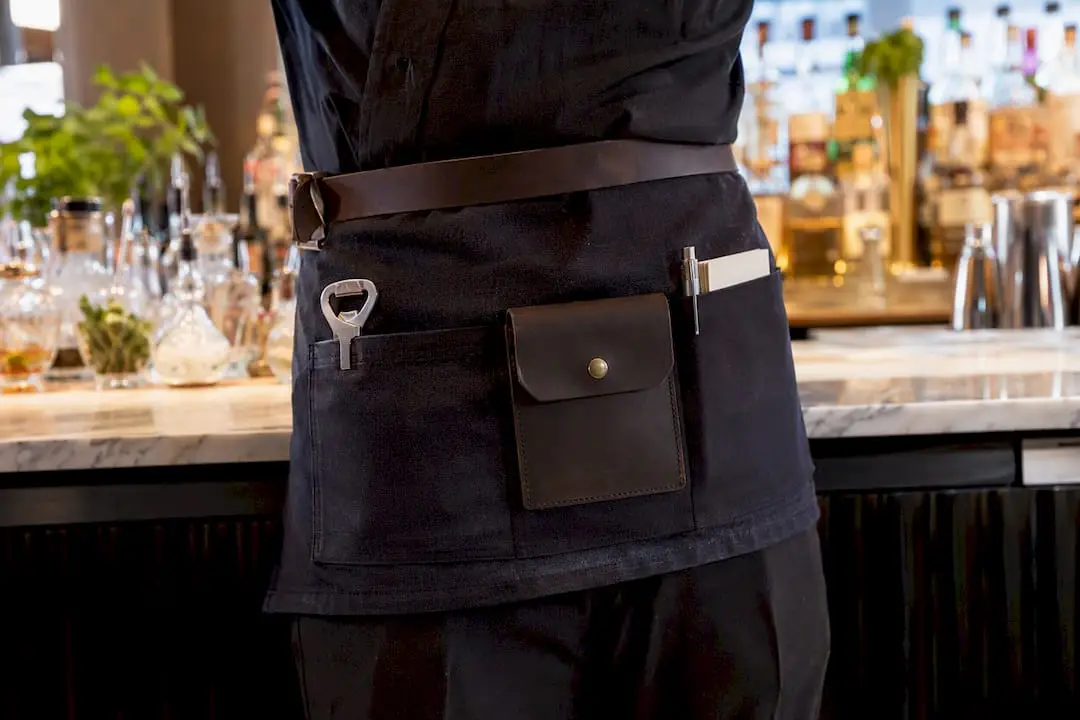 Bartender apron pockets holding tools