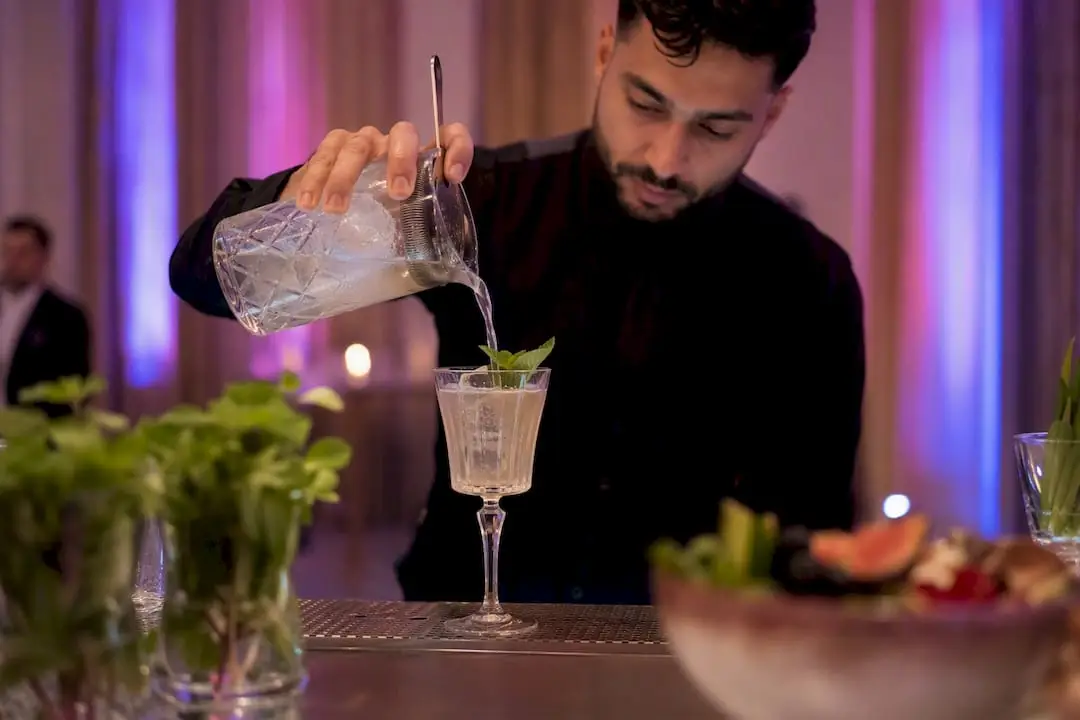 Bartender pouring a halal-friendly mocktail