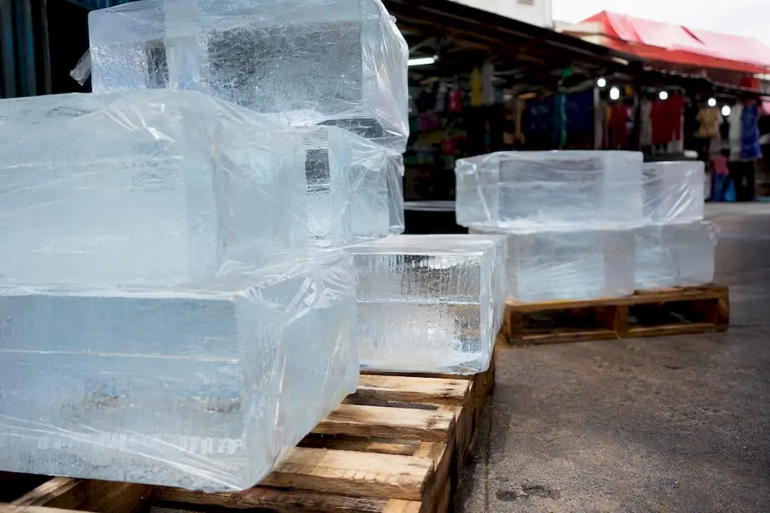 Stacked commercial block ice in warehouse