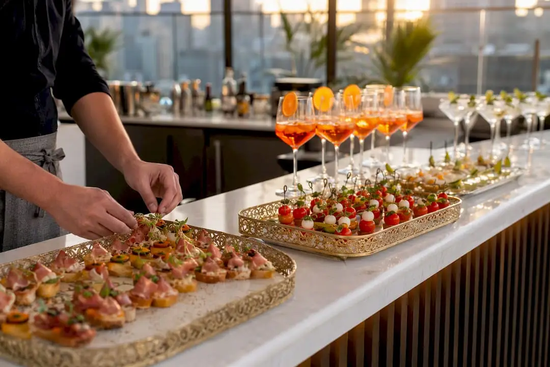 Bartender arranging appetizers on bar